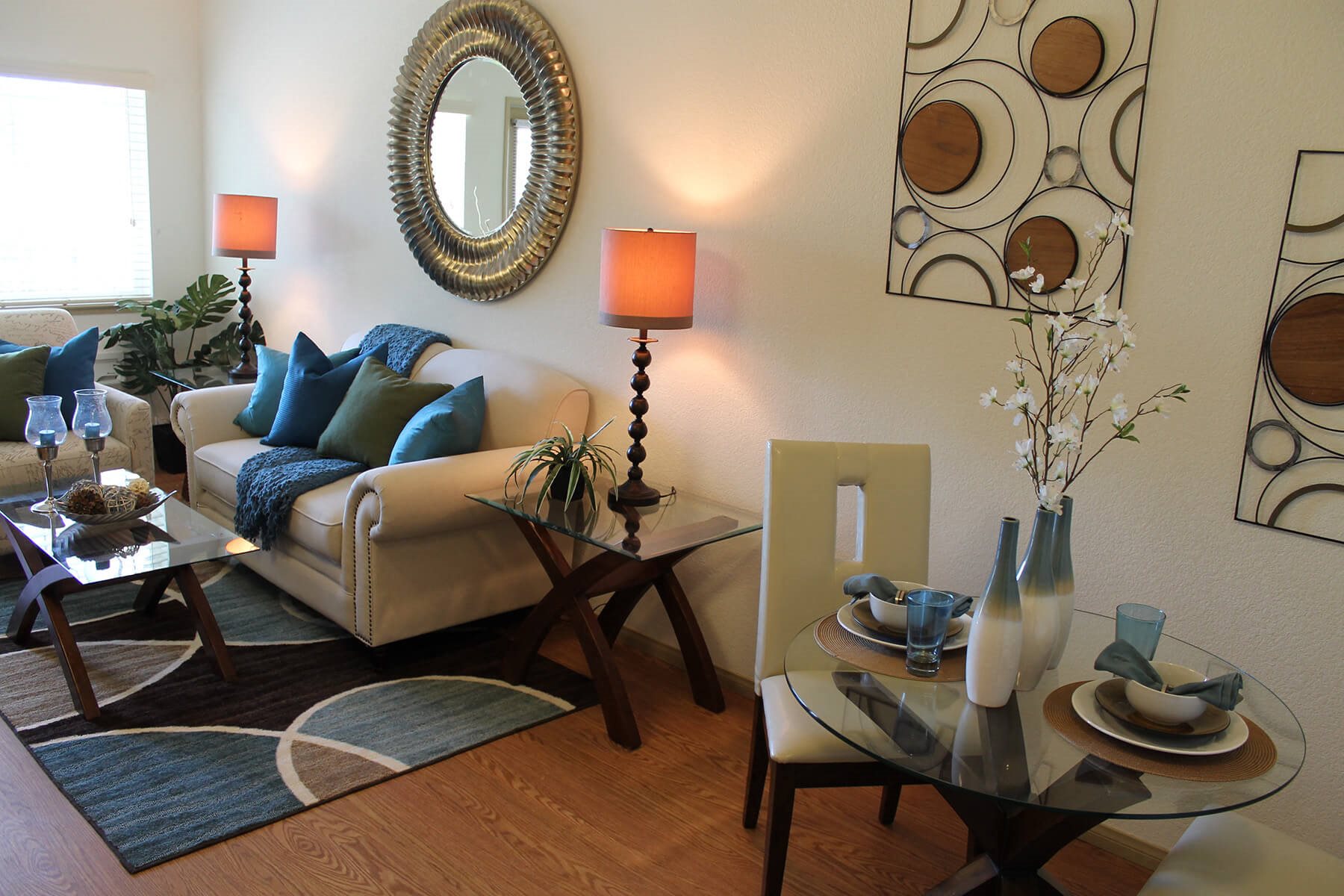 Model Living Room and Dining Table at The Lodge at Morgan Hills Apartments in Morgan Hill CA